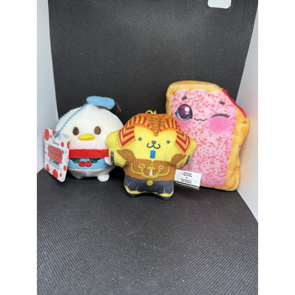 Lot 4 Plush – Jurassic World Blue, Yu‑Gi‑Oh Hello Kitty, Disney, Pop‑Tart